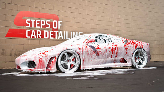 red ferrari by brown brick wall