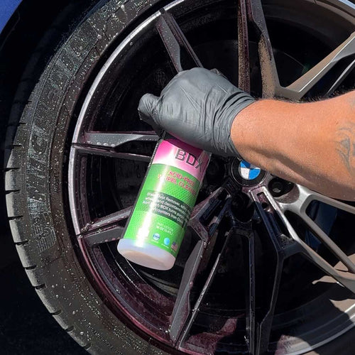 spraying bdx iron remover on bmw m wheel