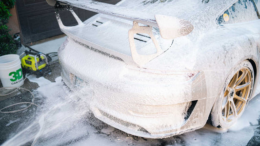 porsche 911 gt3 covered in foamy car wash soap