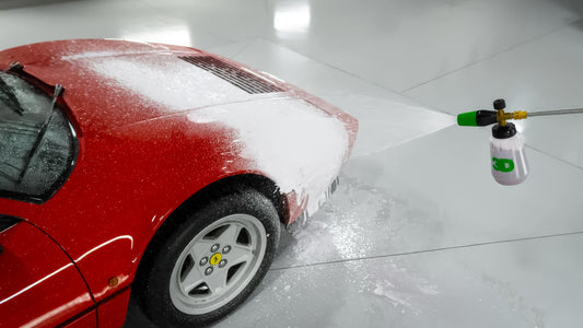 3d car care foam cannon being used on vintage red ferrari