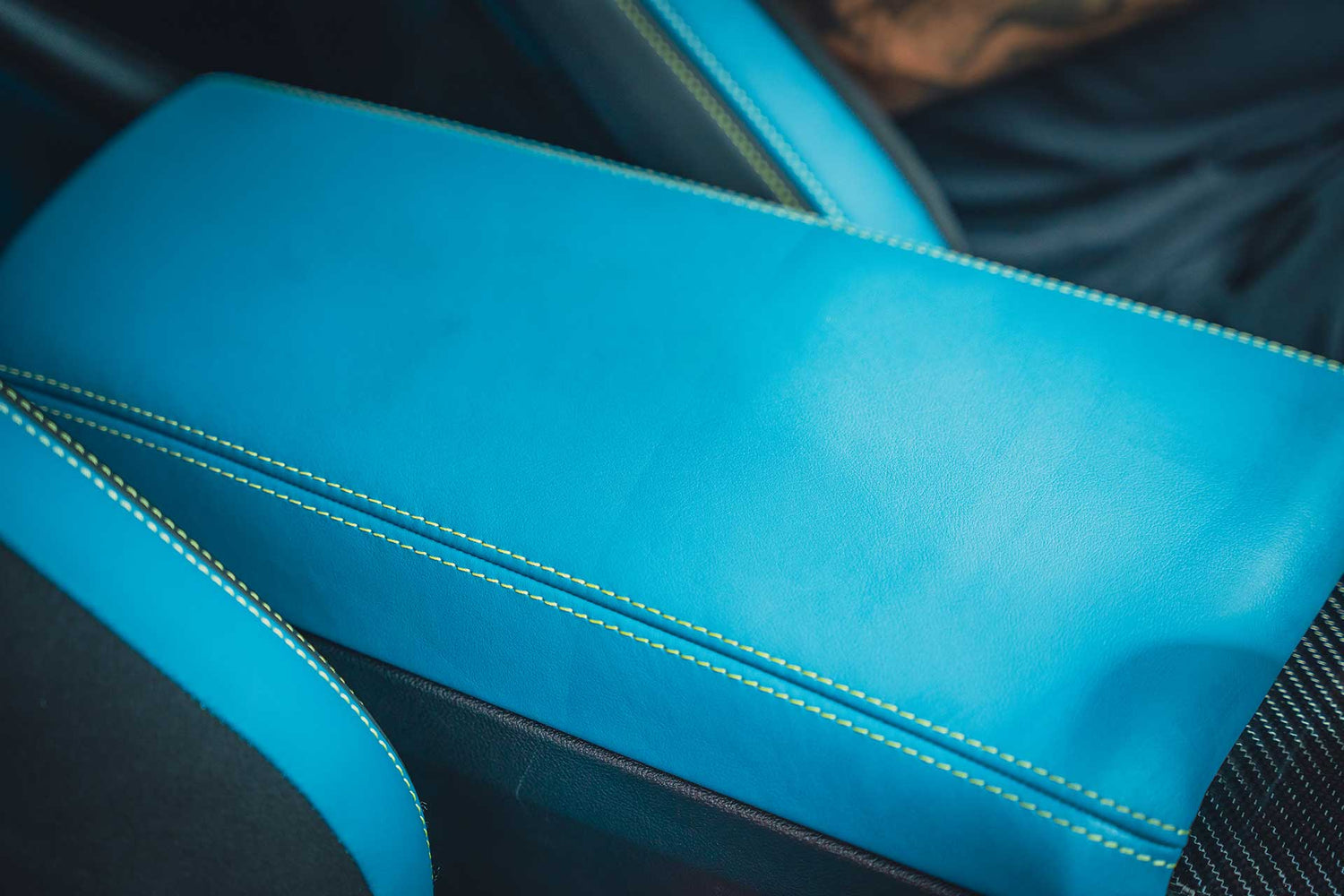 blue leather center console before and after leather conditioner